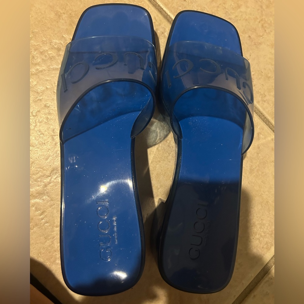 Bright beautiful blue jelly Gucci slippers, rain or shine - they can handle it